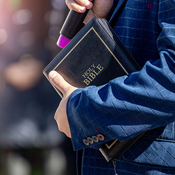 Pastor Holding Bible